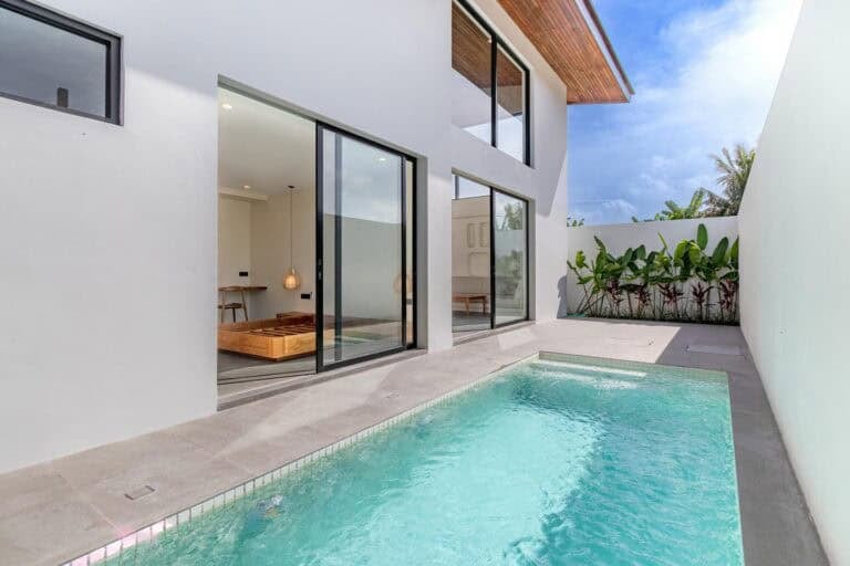 Modern villa with sliding doors and pool