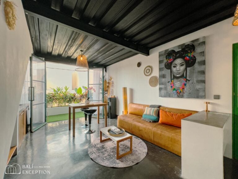 Modern living room with art and balcony view