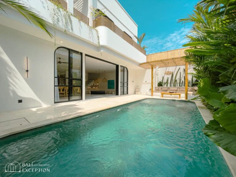 Modern villa with pool and tropical garden.