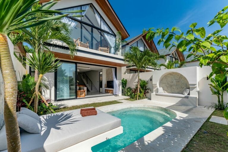 Modern villa with pool and tropical garden.