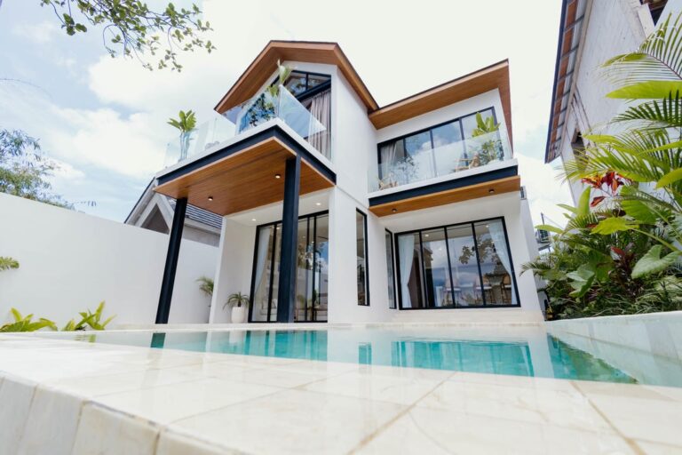 Modern house with pool and garden view.