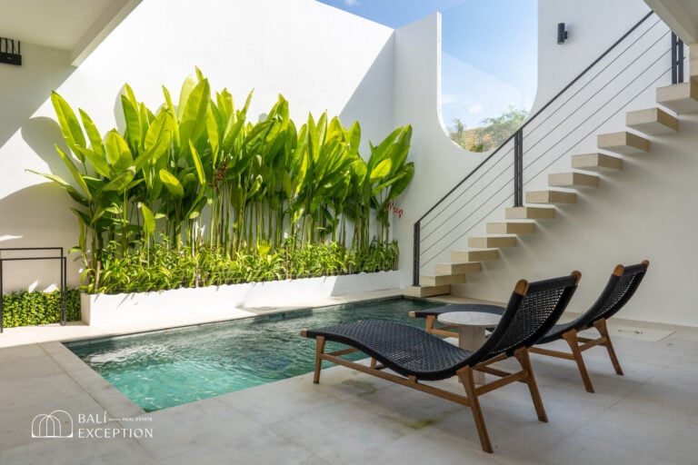 Modern patio with pool and greenery