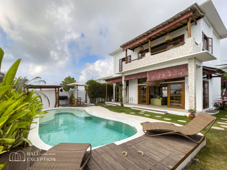 Modern villa with pool and patio area.