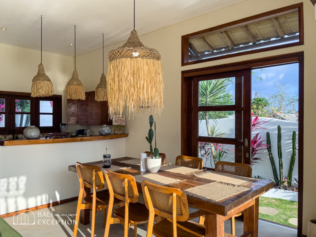 Cozy dining area with wooden furnishings and natural light.