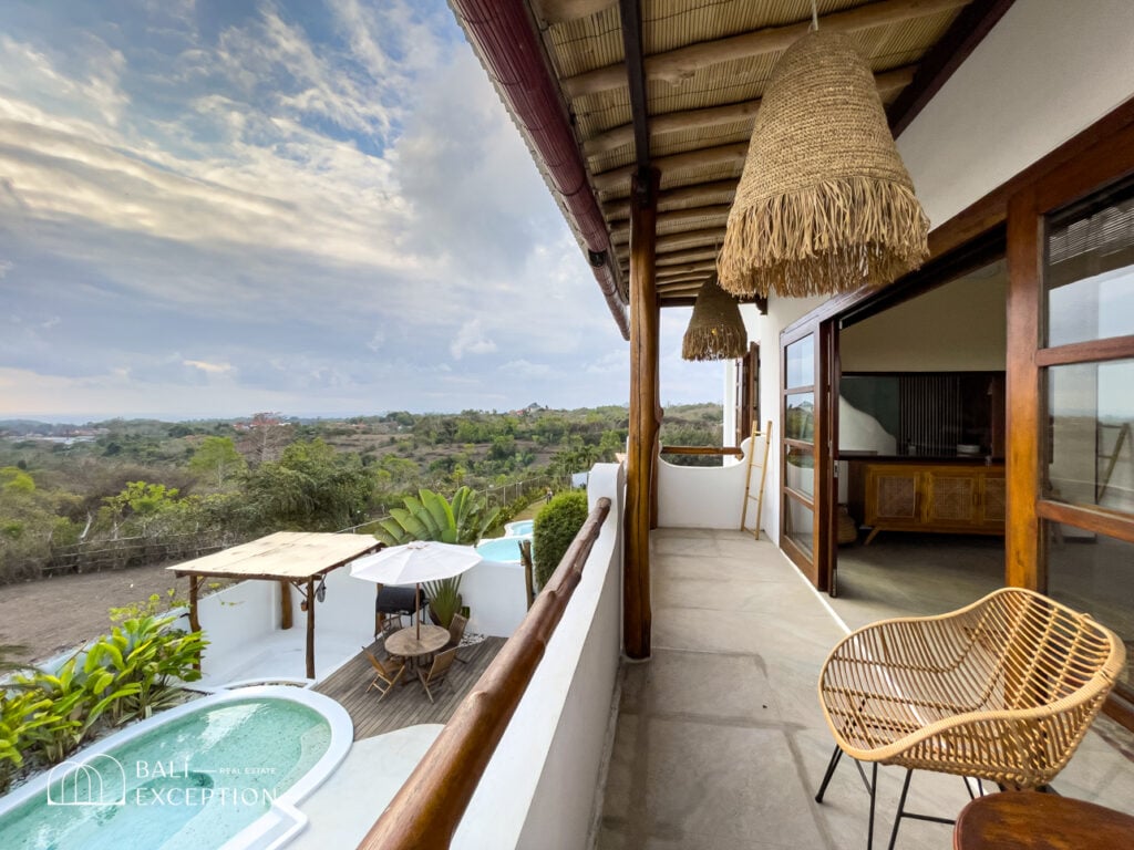 Balcony with scenic view and outdoor seating area.