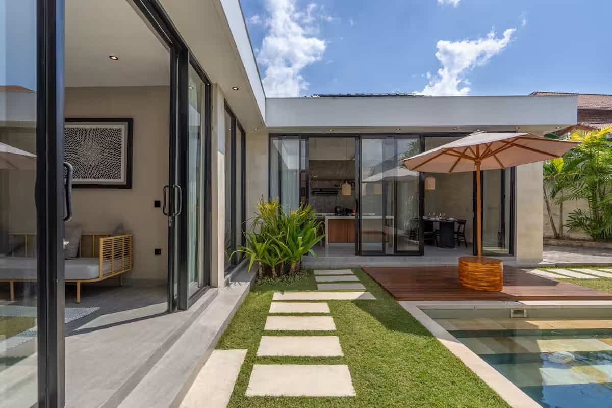 Modern patio with pool and glass doors