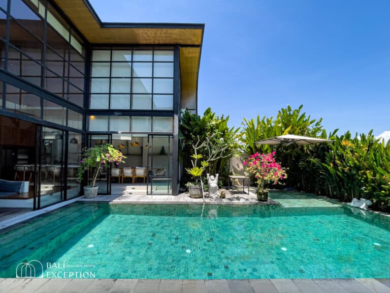 Modern house with pool and garden patio.