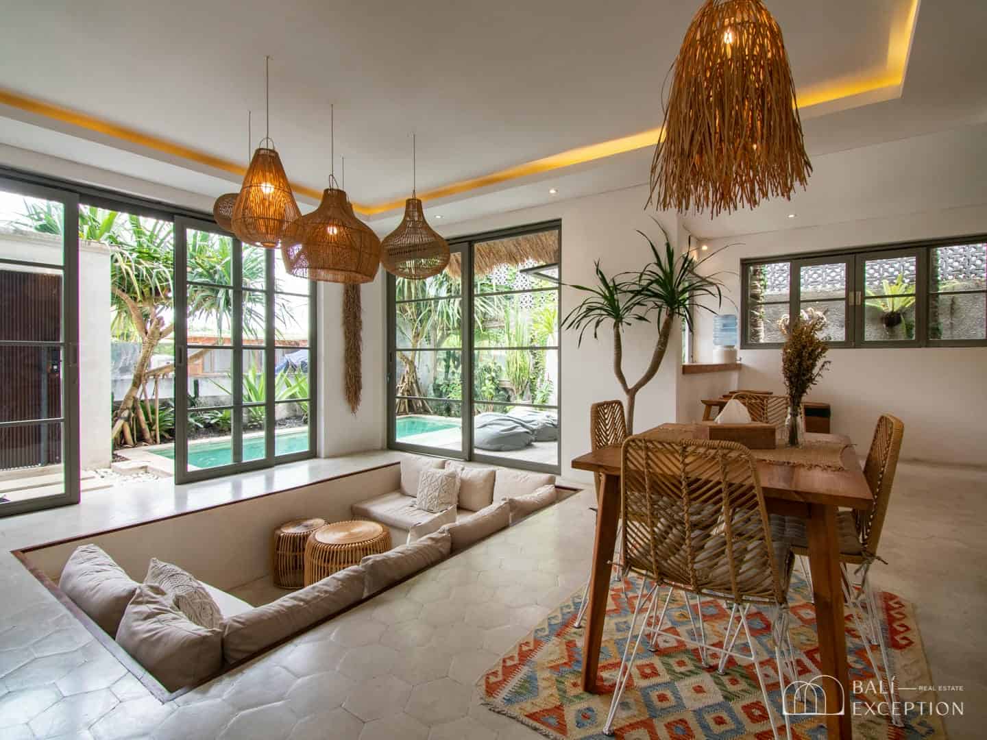 Modern living room with poolside view.