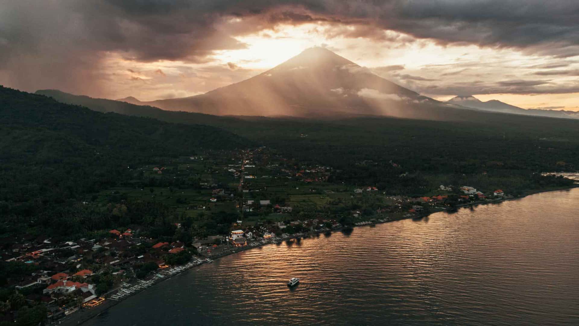 Sunset over mountain and lakeside village