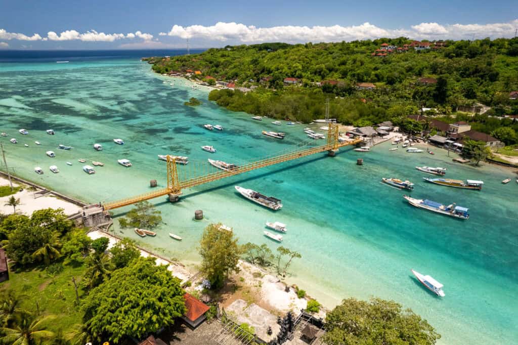 Aerial view of a tropical island with boats