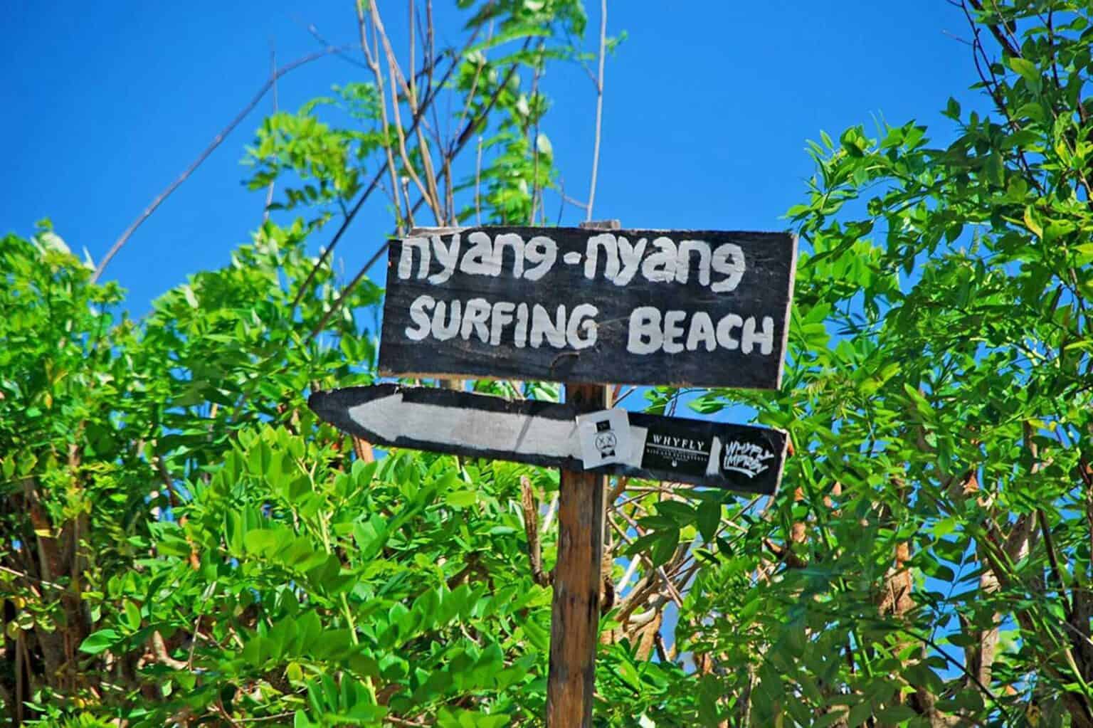 Nyang Nyang Surfing Beach sign among greenery