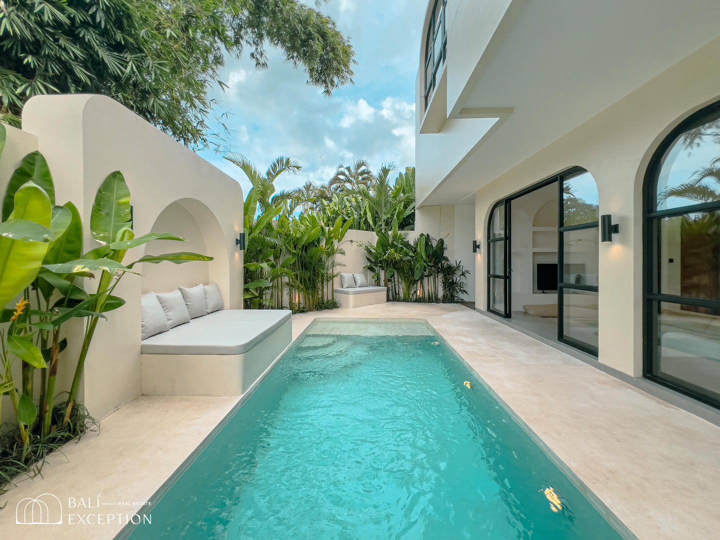 Modern villa with pool and tropical plants