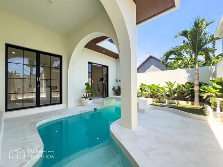 Villa patio with pool and garden views.