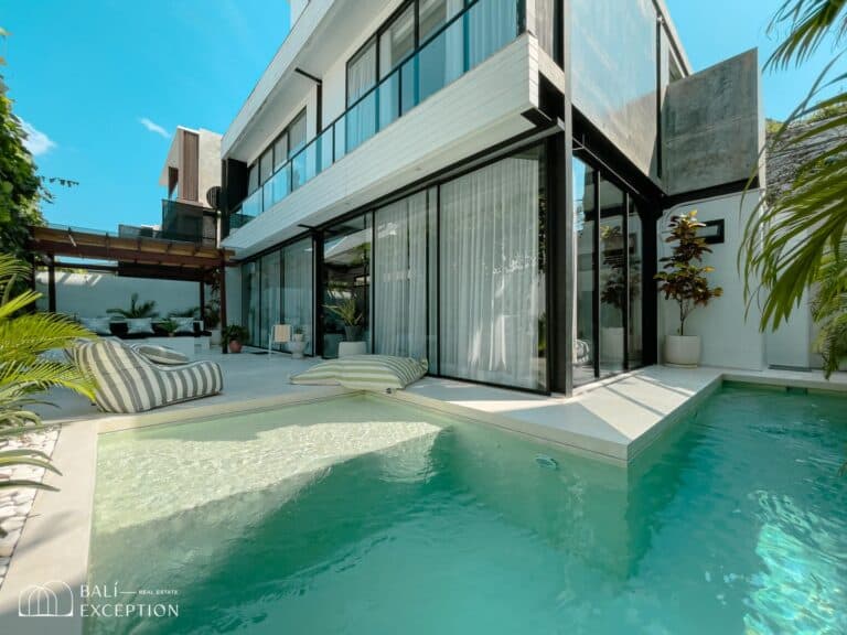 Modern villa with pool and patio area.