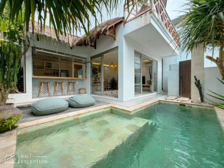 Modern villa with patio and pool.
