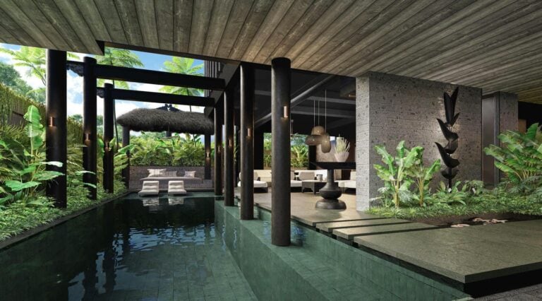 Modern tropical villa with pool and lush greenery.