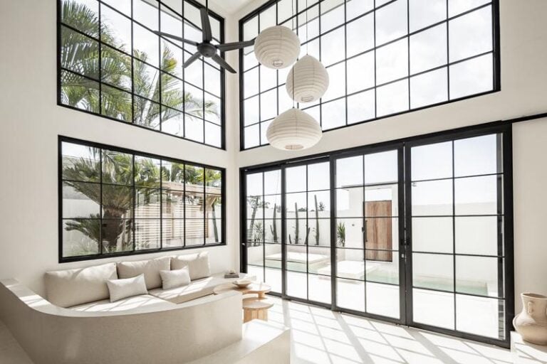 Modern living room with large windows and minimalist design.