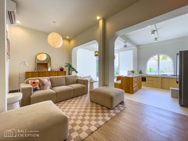 Modern living room with kitchen and beige furniture