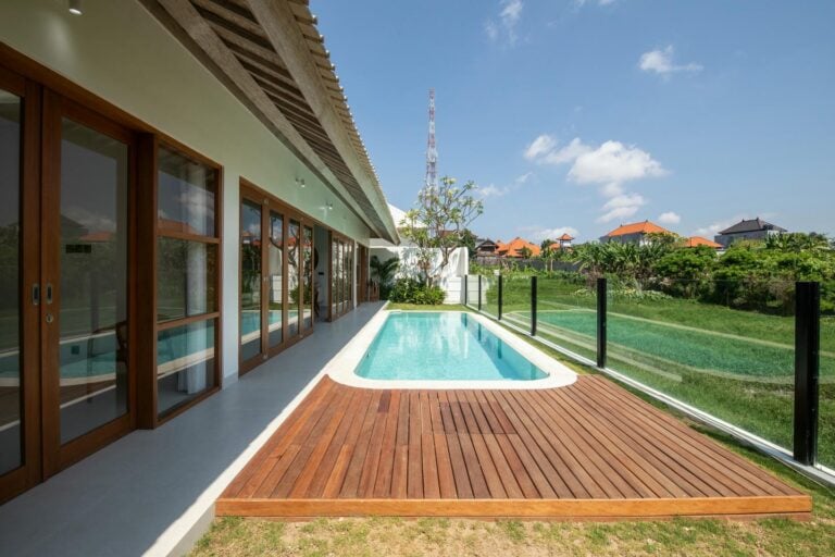 Modern villa with pool and garden view.