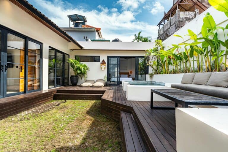 Modern patio with seating and plants.