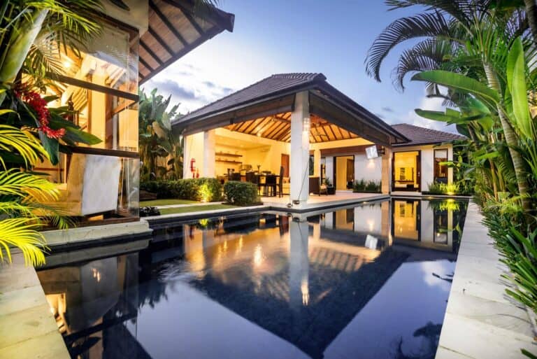 Luxurious villa with tropical garden and pool.