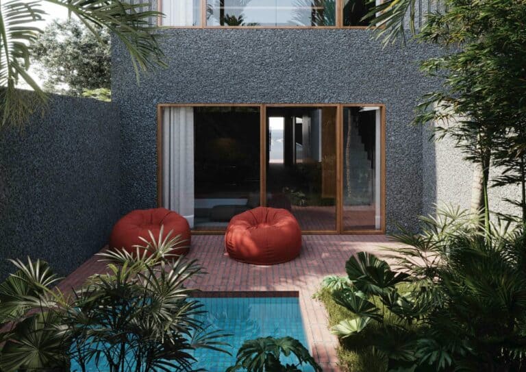 Modern courtyard with pool and red bean bags.