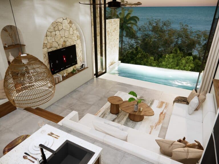 Luxury beachfront villa with pool and modern decor.