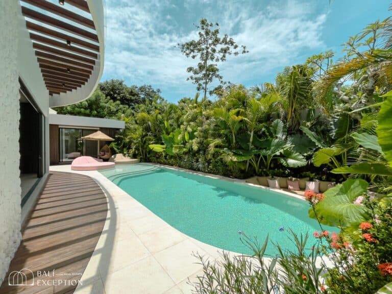 Luxury tropical villa with pool and lush garden.