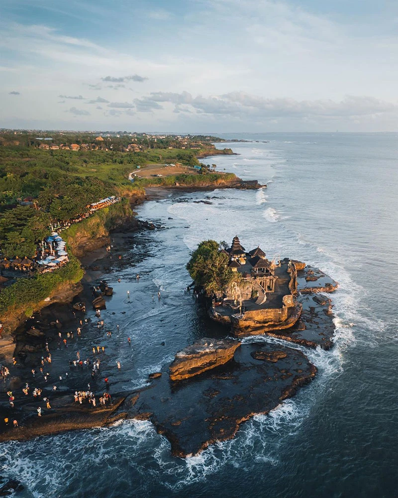 Aerial view of ocean temple on rocky coast, Bali.