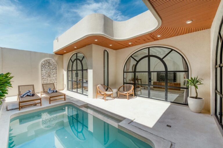 Modern patio with pool and glass doors