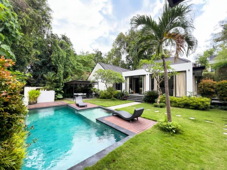 Modern house with pool and lush garden