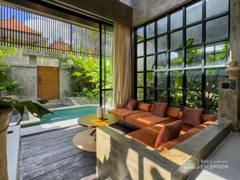Modern living room with poolside view.