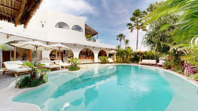 Luxury villa with pool and tropical garden.
