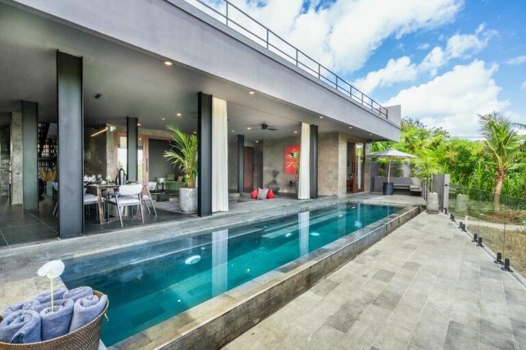 Modern villa with an outdoor pool and patio.