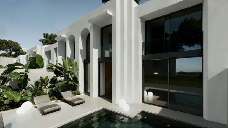Modern villa exterior with pool and loungers