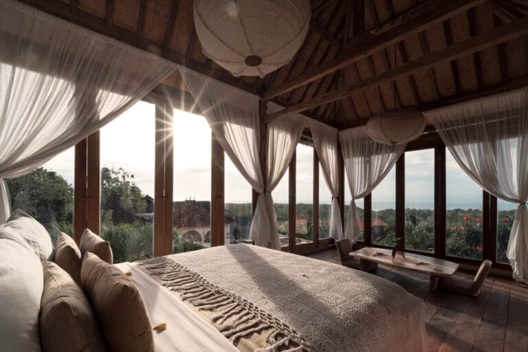 Cozy bedroom with panoramic countryside view.