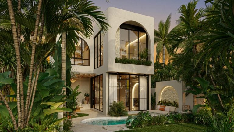 Modern tropical villa with lush garden and pool.