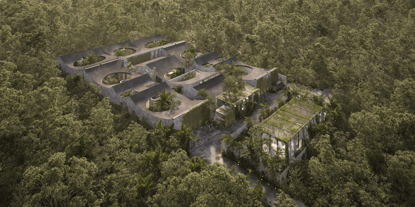 Aerial view of modern buildings surrounded by trees.