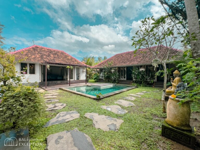 Tropical villa with pool and lush garden.