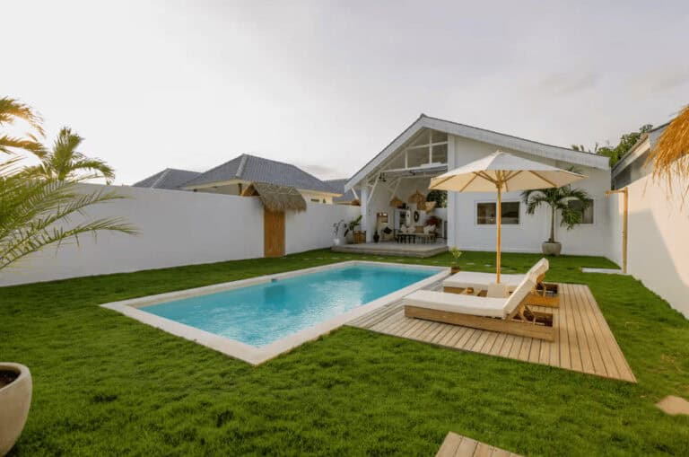 Modern backyard with pool and lounge chairs