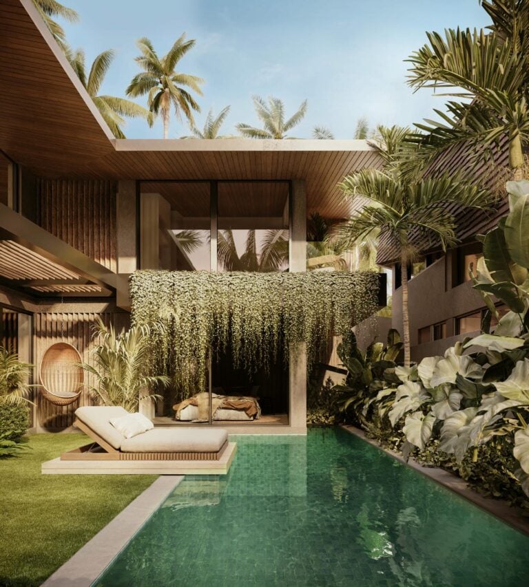 Tropical villa with lush poolside greenery.