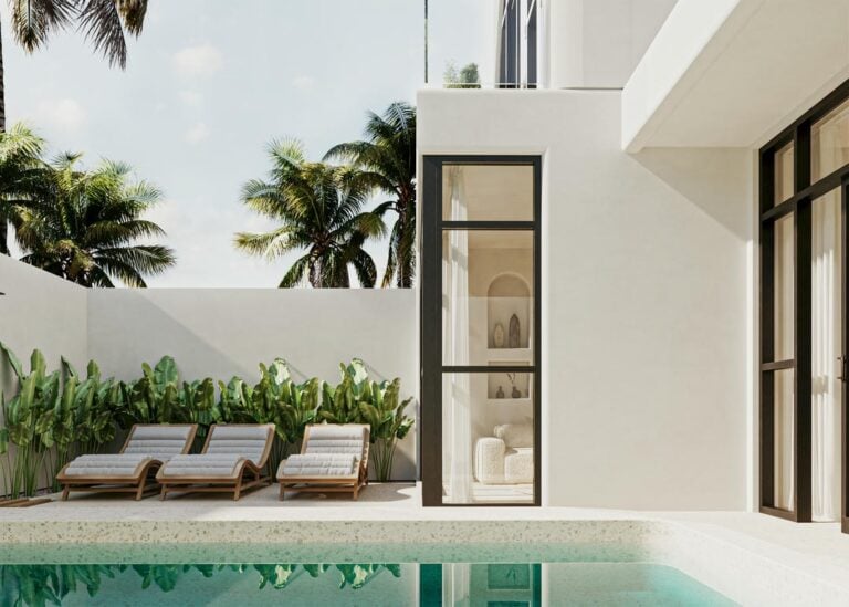 Modern patio with pool, loungers, and palm trees.