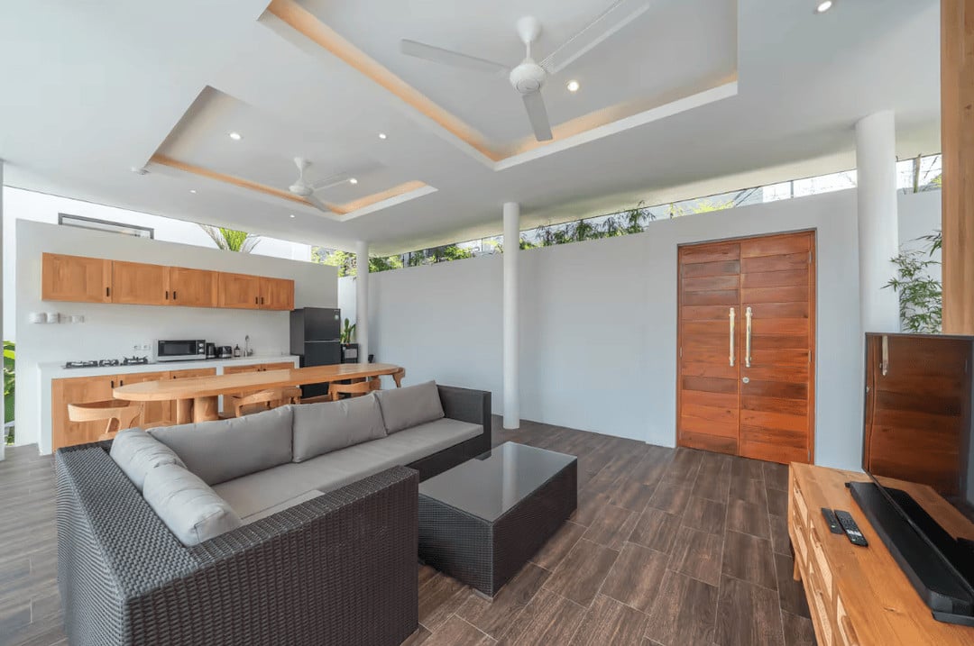 Modern living room with open kitchen and sofa